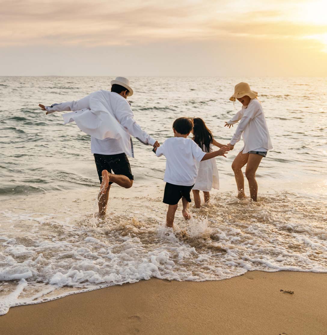 Family Playing On Beach