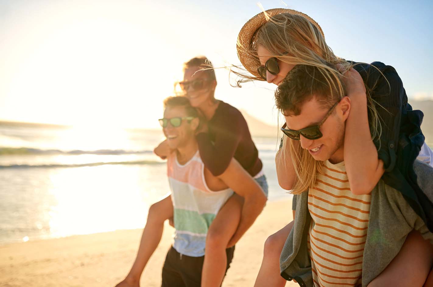 Happy Couples On Beach